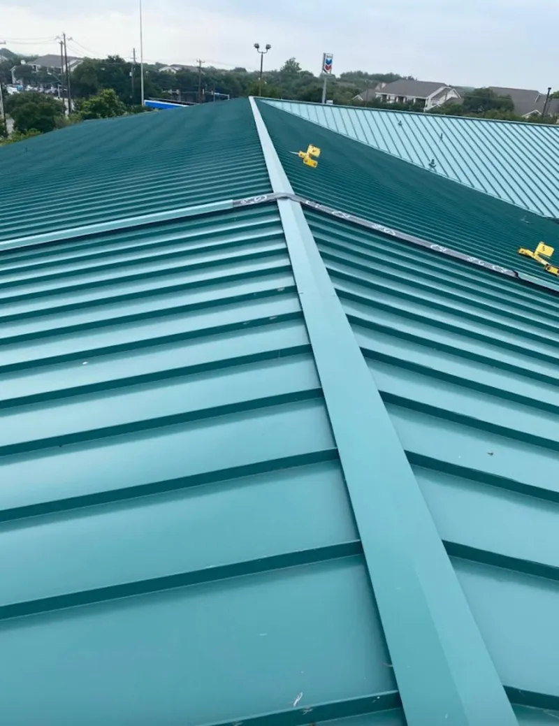 Green commercial metal roof ridge and valley for Metal Roof Repair in St. Marys